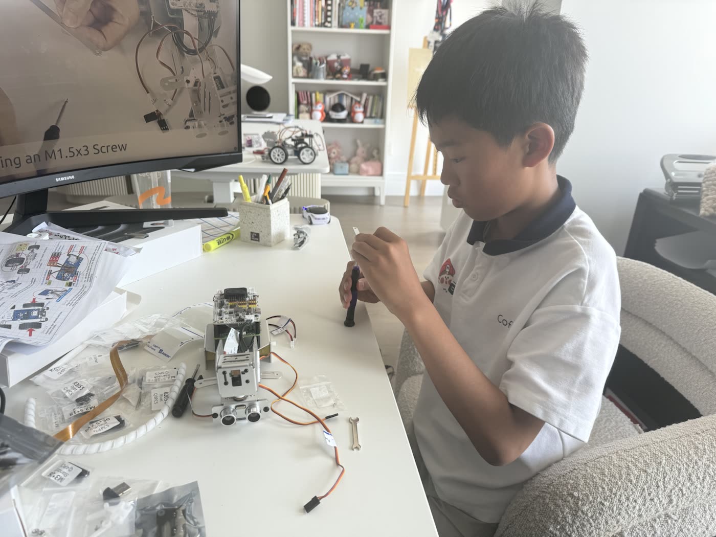 Edwin assembling the smart car at a desk